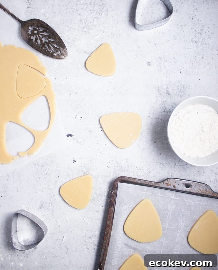 overhead shot of cut out candy corn shaped sugar cookies