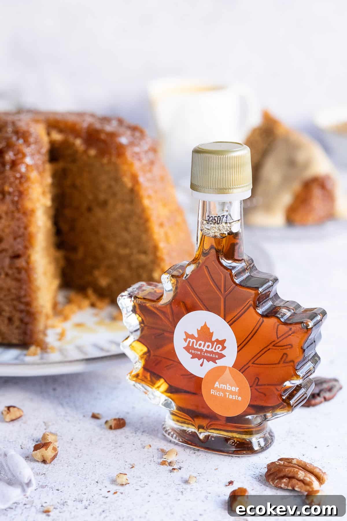 A bottle of maple syrup shaped like a maple leaf.