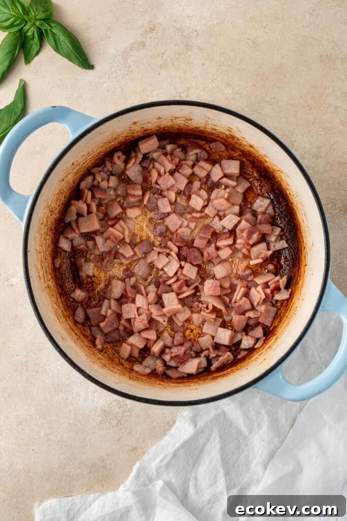 Cooking the bacon in the pot.