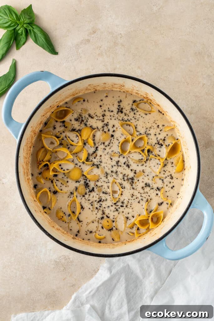 The pasta and liquid in the pot.