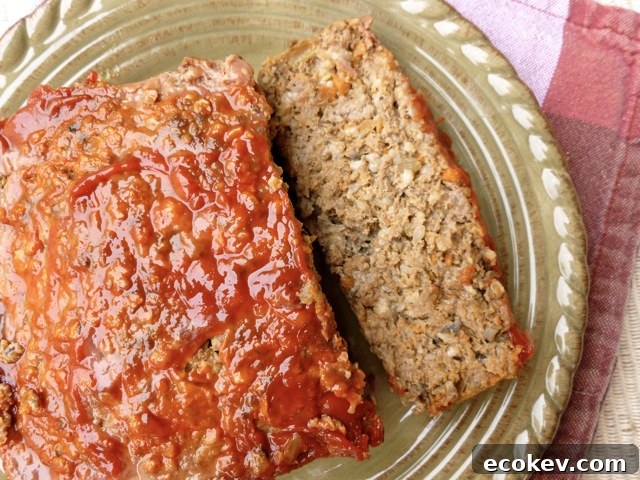 Slices of baked meatloaf on brown dinner plate.