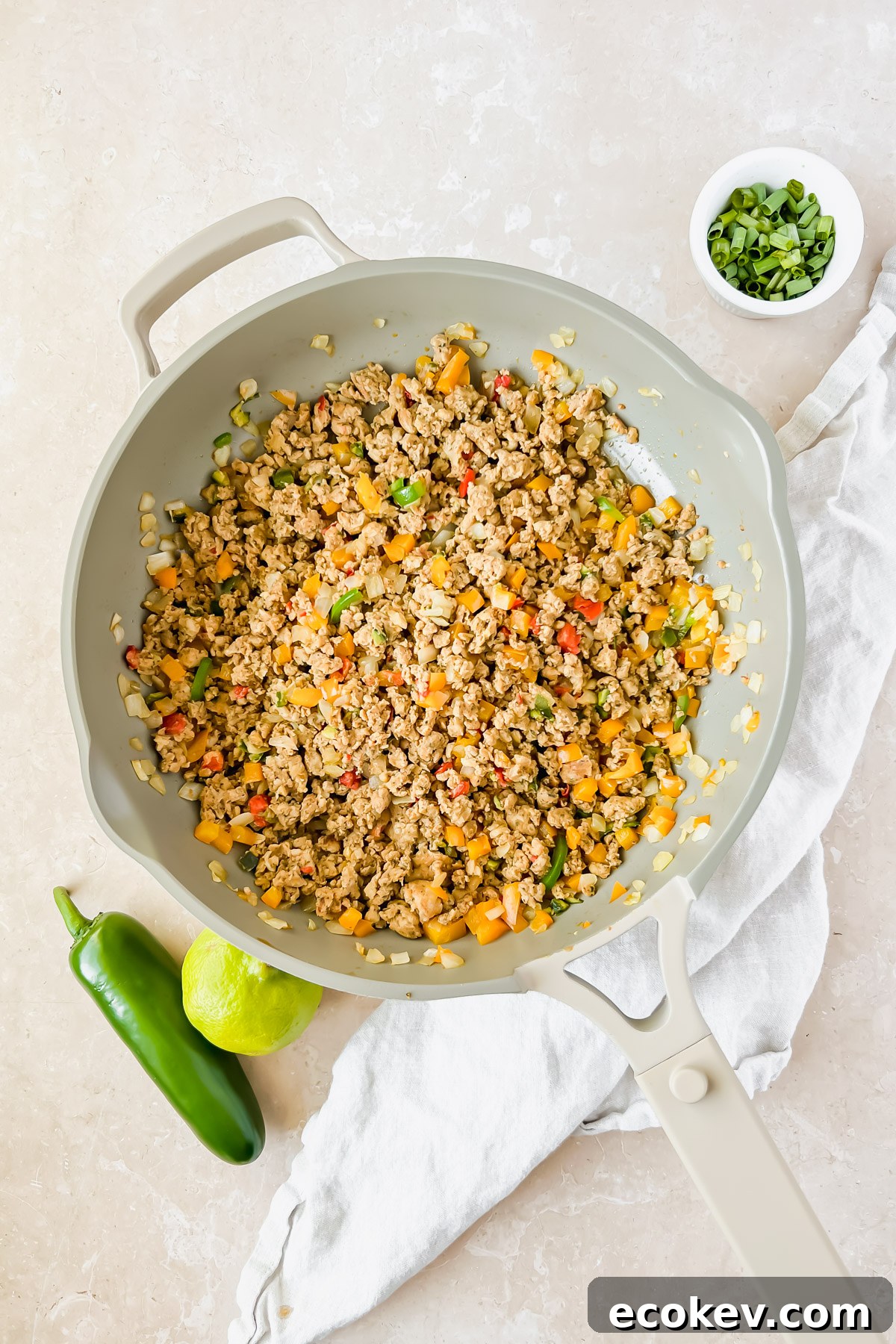 Ground chicken cooking with vegetables