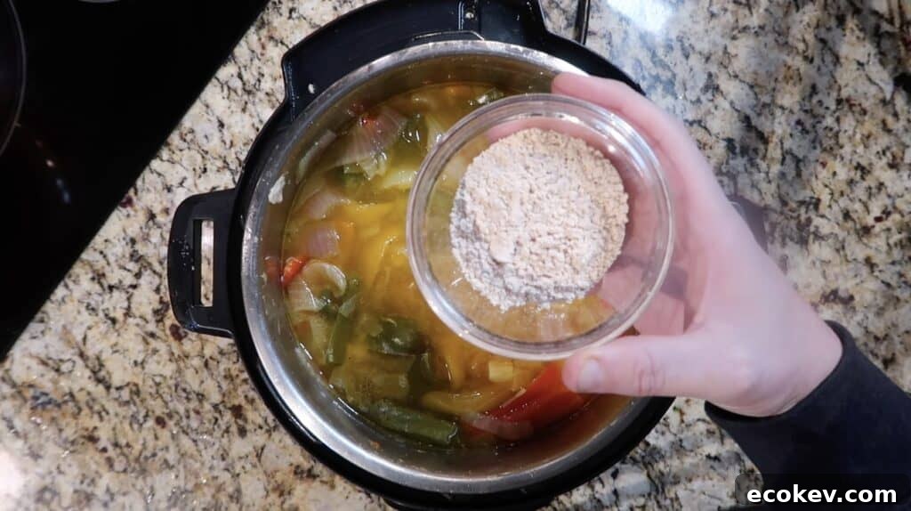 Adding fajita seasoning to pot