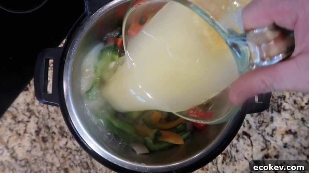 Adding broth to pot