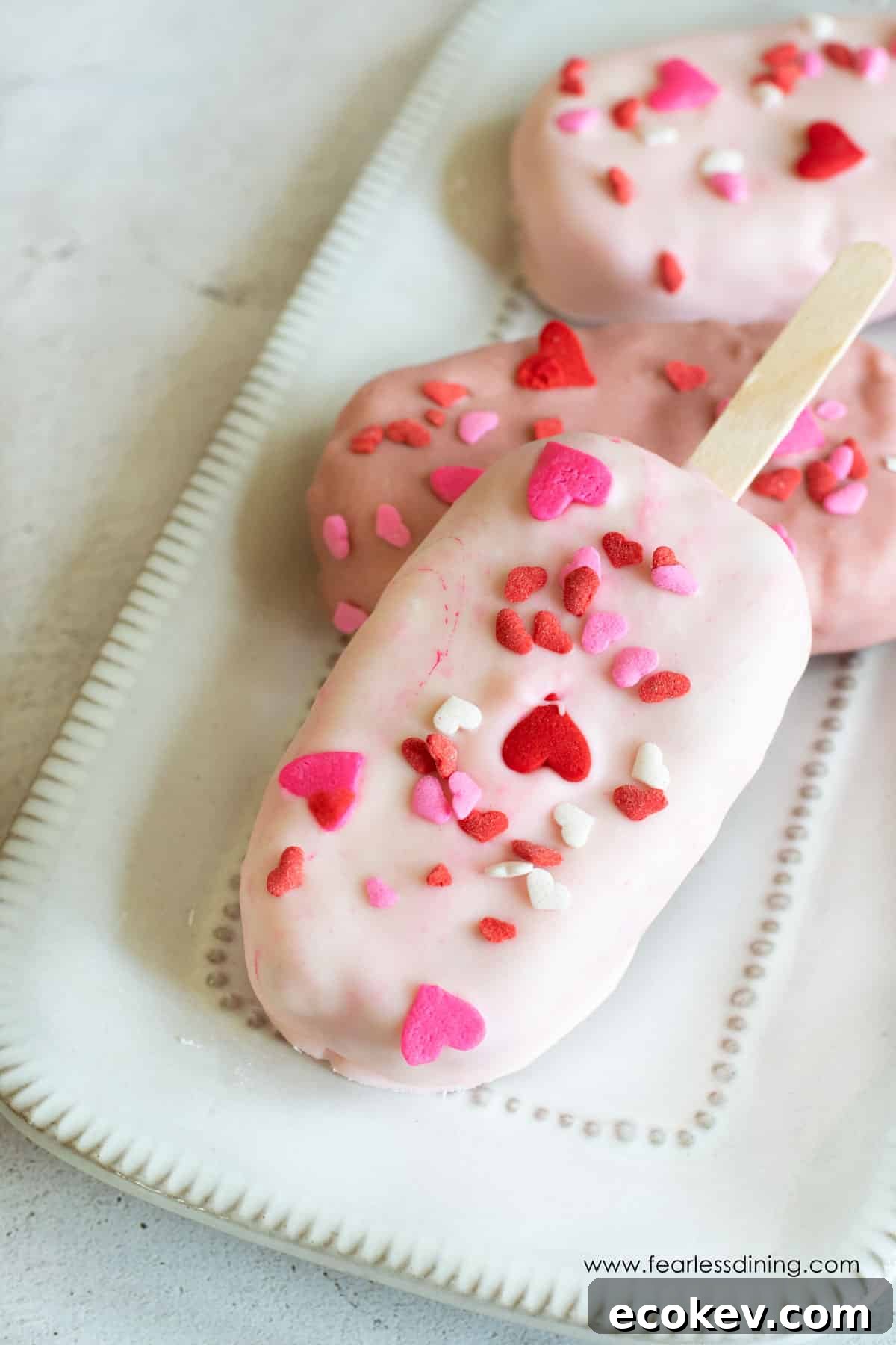 Valentine's day cakesicles on a plate.