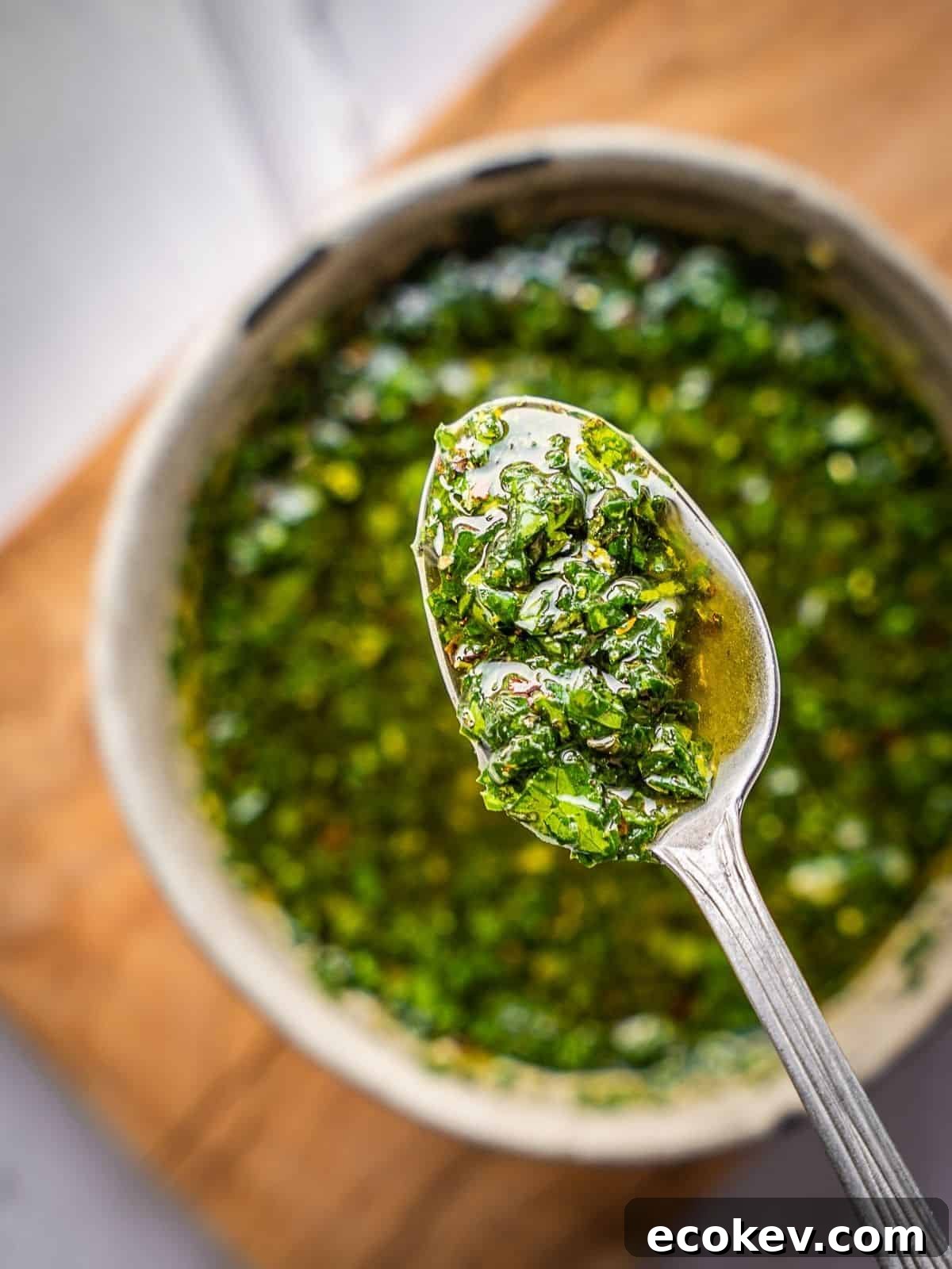 Mint chimichurri in a spoon.