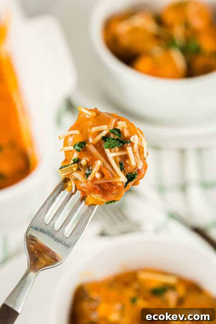 fork holding up a bite of keto meatball casserole